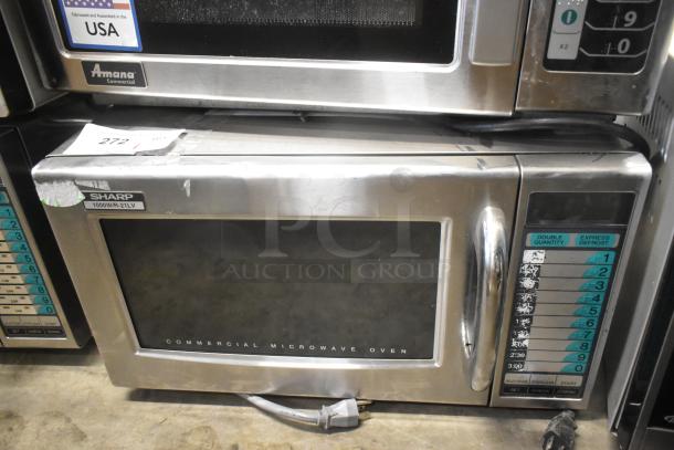 2023 Sharp R-21LVF stainless steel commercial microwave oven, 120V, 1 Phase, visible wear on control panel, model R-21LVF.
