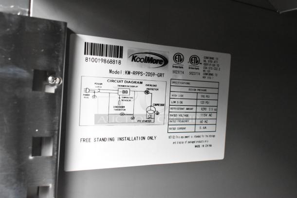 Tag showing model KoolMore KM-RPPS-2D59-GRT, 115V, 1 Phase. Design pressure: 190 PSI high, 120 PSI low. Made in China.