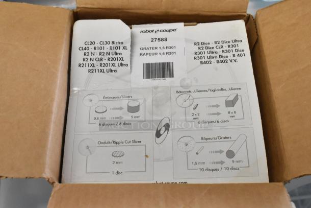 Box of kitchen tools featuring a Robot Coupe 27588 grater blade. Includes slicer, skimmer, and metal fry basket.