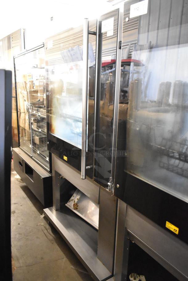 Fri-jado TDR7-P stainless steel electric rotisserie oven on casters, 208V, 3 phase, good condition, labeled controls.