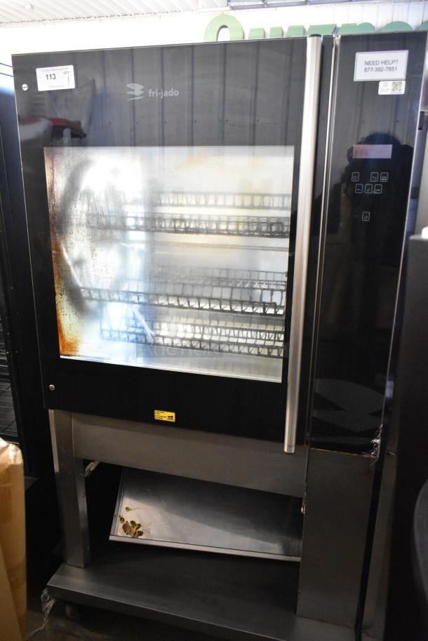 Fri-jado TDR7-P stainless steel electric rotisserie oven on casters, 208V, 3-phase. Visible wear on glass door.
