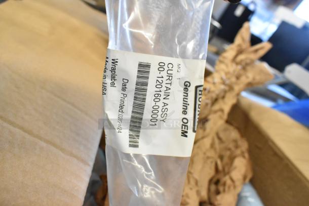 Brand new Vulcan splash curtain, model 00-892567-00001, with OEM label indicating genuine part, minor scratches and dents visible.