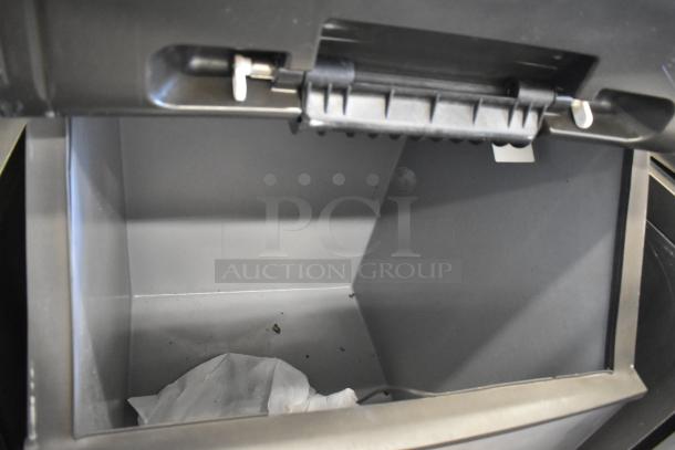 Manitowoc IY1004A-261 ice machine head on B570 bin, stainless steel, 208-230V, 1 phase, shown open.