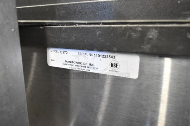 Manitowoc IY1004A-261 stainless ice head on B570 bin. Features 208-230V, 1 phase. Model B570, Serial 1101223543. NSF certified.
