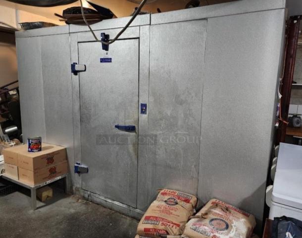 8'x10' Bally walk-in box with silver exterior and blue handles, includes 3 compressors; visible in storage setting.