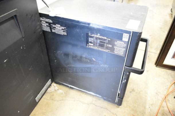 Merrychef metal commercial electric rapid cook oven, countertop model, 208/240 volts, 1 phase, visible wear, manufacturer labels.