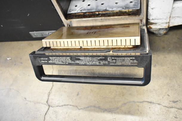 Merrychef metal commercial rapid cook oven, countertop model, electric, 208/240 volts, 1 phase, visible use marks, controls labeled for safety.