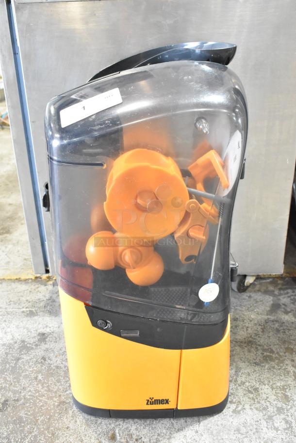 2025 Zumex MINEX metal countertop citrus juicer, orange finish, excellent condition, 100-240V, 1 phase power.