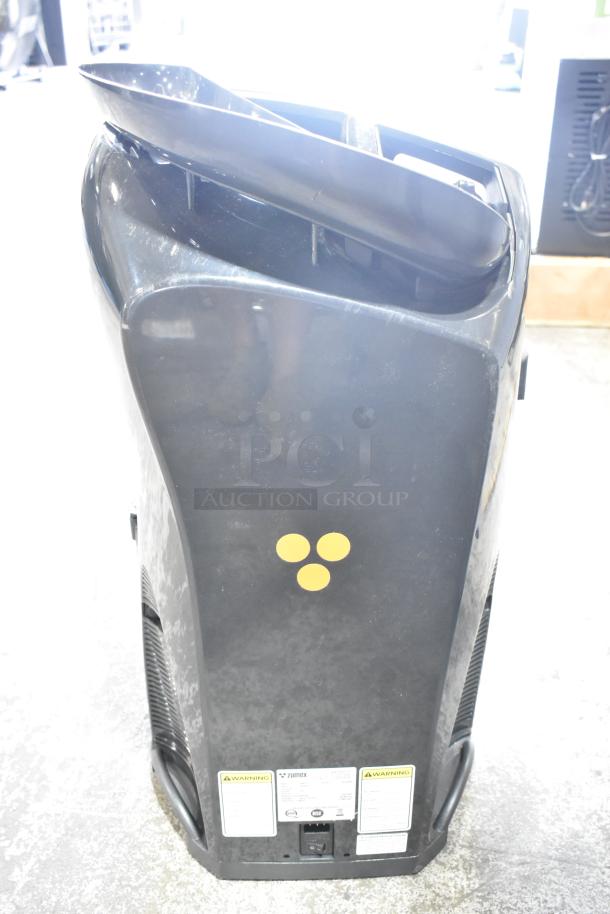 2025 Zumex MINEX metal citrus juicer, commercial countertop model, black finish, visible power specifications and warning labels.