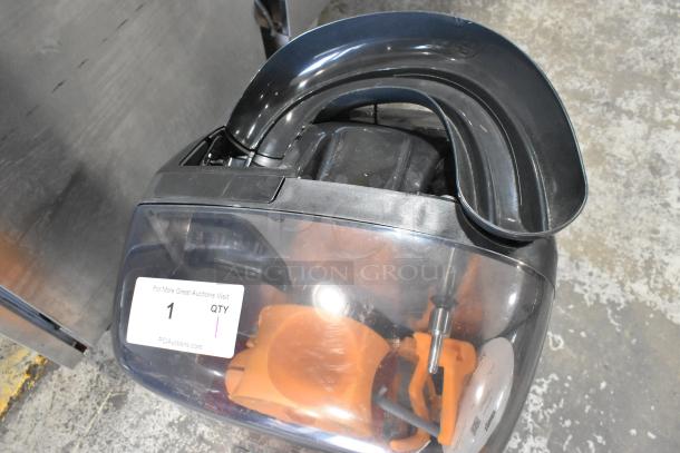2025 Zumex MINEX commercial citrus juicer, black metal, countertop model. Voltage: 100-240V, 1 Phase. Visible label: 1 QTY.