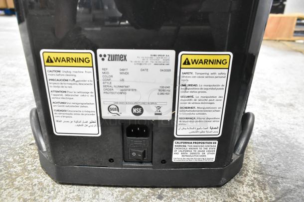 Zumex MINEX Juicer, model 04917. Voltage: 100-240V, 1 Phase. Labels show warnings and specifications. Serial: NUM48787.