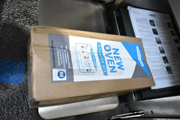 New oven starter kit box with instructions, NSF certified label, and Turbochef branding on a kitchen counter.