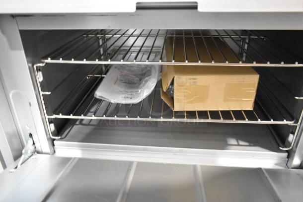 Brand new Mainstreet 541E36L stainless steel 6-burner range interior with oven racks, box, and manual. 210,000 BTU.