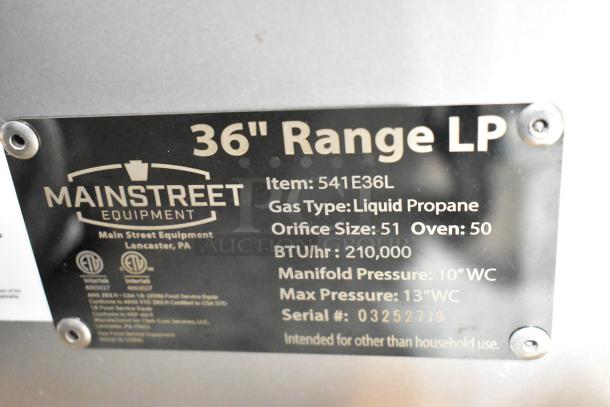 Mainstreet 541E36L stainless steel commercial 36" range label. Liquid propane, 210,000 BTU, serial 03252719.