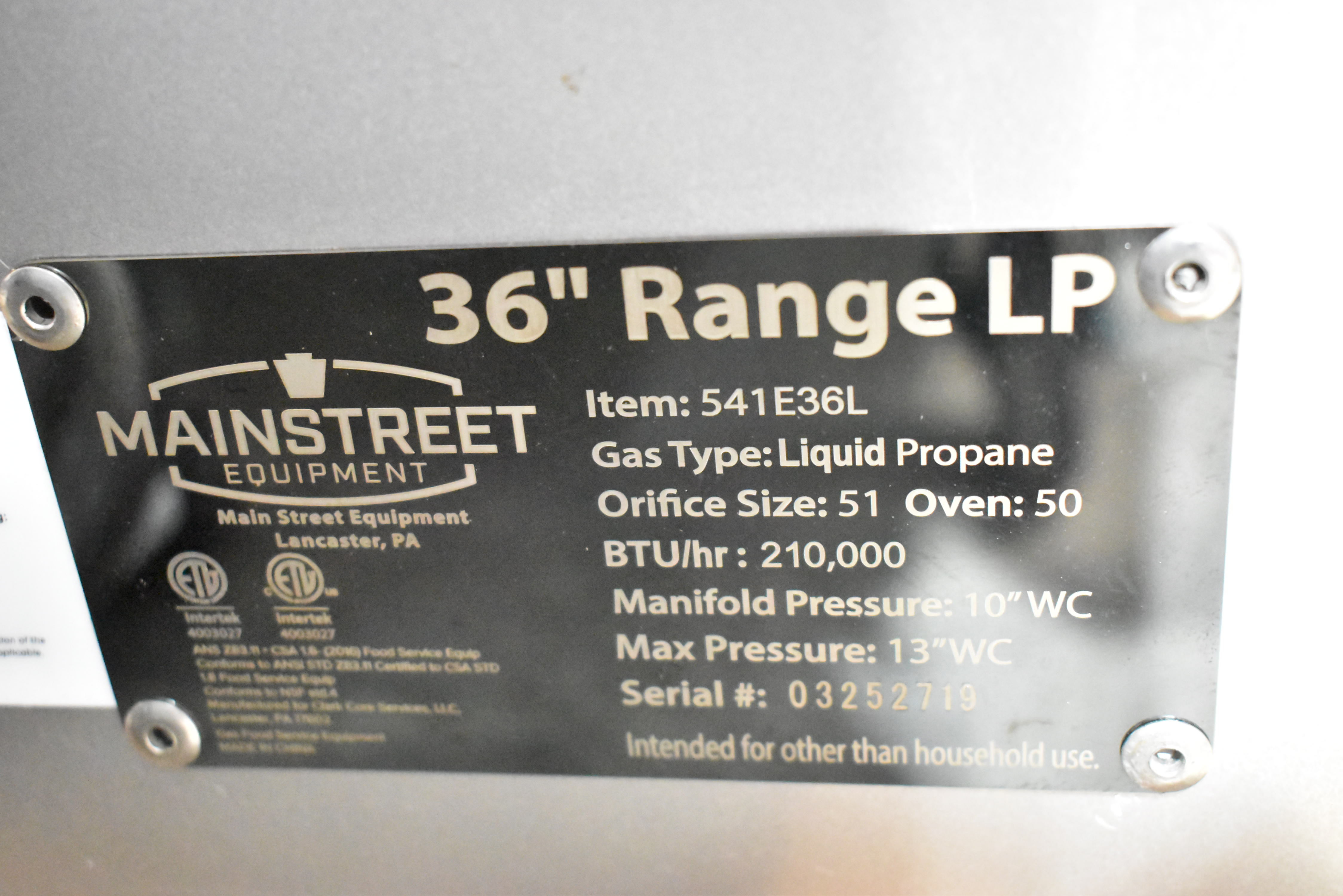 Commercial range specification plate showing model and BTU information