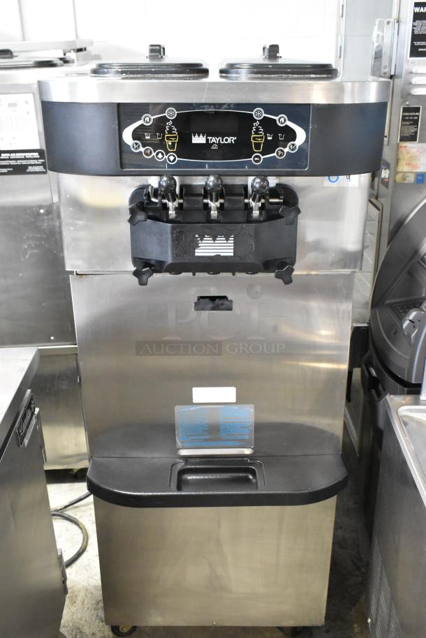 Taylor C723-33 stainless steel soft serve ice cream machine, 2-flavor with twist, water-cooled, on commercial casters.