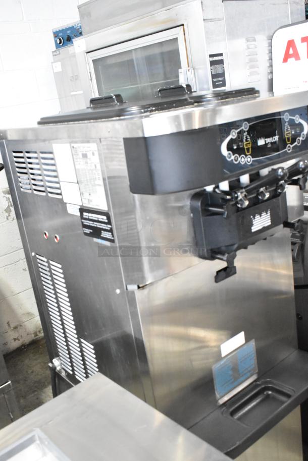 Stainless steel Taylor C723-33 soft serve ice cream machine, 2 flavors with twist, on casters, water-cooled, 208-230V, 3 phase.