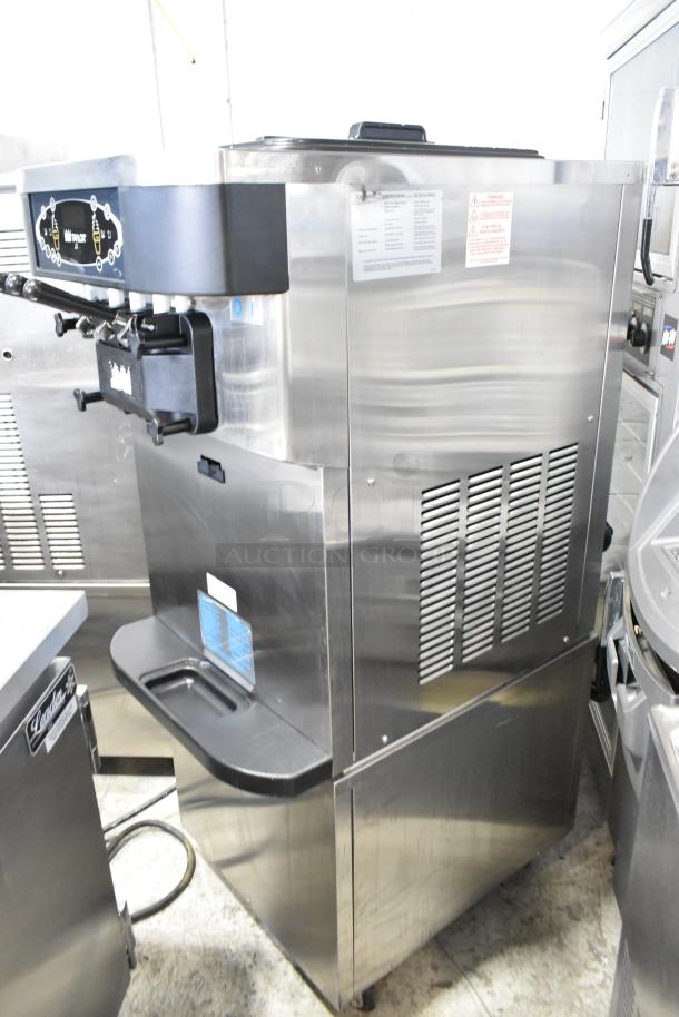 Taylor C723-33 stainless steel soft serve ice cream machine, 2-flavor twist, water-cooled, commercial casters, 208-230V, 3-phase.