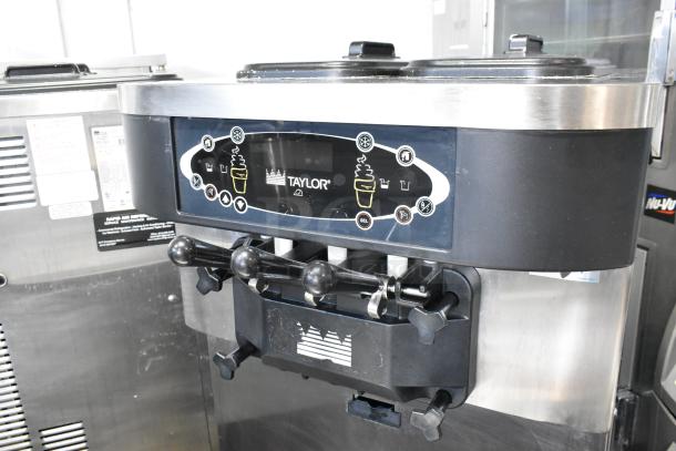 Taylor C723-33 stainless steel soft serve ice cream machine; 2 flavors with twist feature, water-cooled, commercial casters, 208-230V, 3 phase.