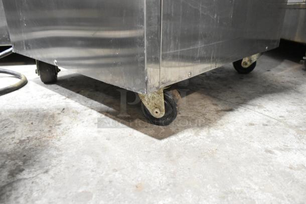 Taylor C723-33 stainless steel soft serve ice cream machine on commercial casters, floor model, 208-230V, 3 phase.