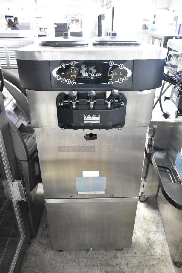Taylor C723-33 stainless steel commercial soft serve ice cream machine, 2 flavors with twist, on casters, 208-230V, 3-phase.