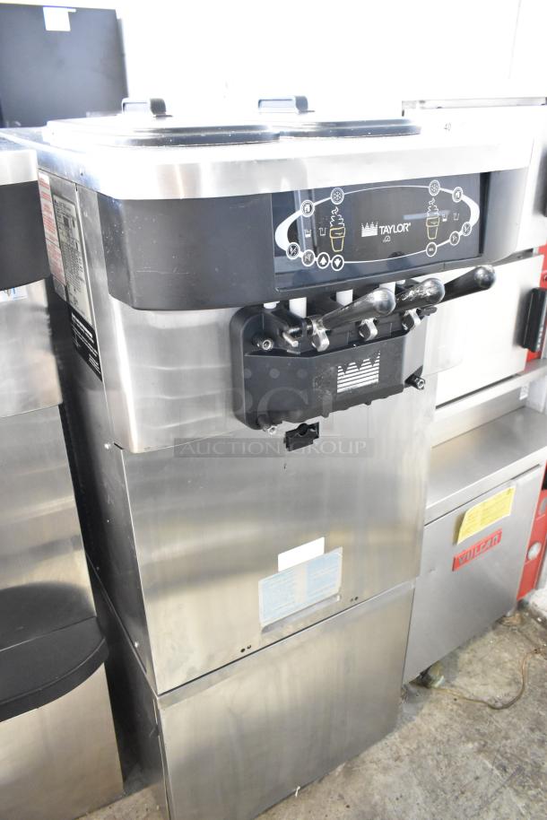 Taylor C723-33 stainless steel soft serve machine, 2-flavor with twist, water-cooled, commercial casters, 208-230V, 3 phase.