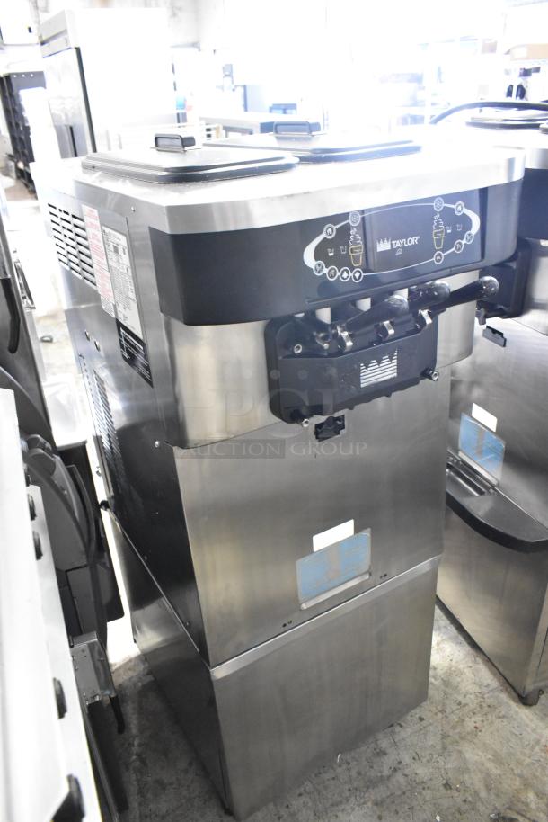Taylor C723-33 stainless steel soft serve ice cream machine, 2 flavors with twist, commercial casters, water-cooled, used.