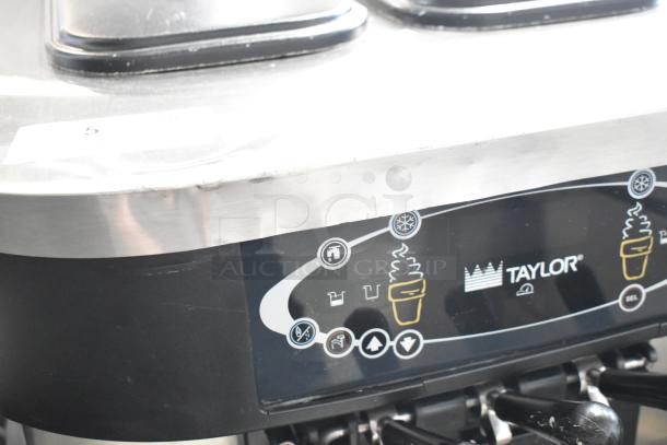 Taylor C723-33 stainless steel soft serve ice cream machine, 2 flavors with twist option, on commercial casters, water-cooled.