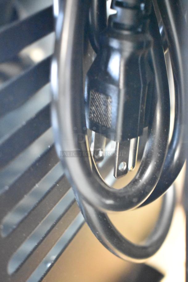 Close-up image of the power cord for the Avantco 178CBE52HC stainless steel commercial chef base.