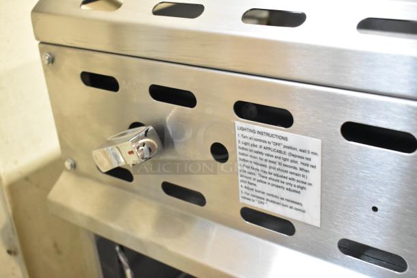 Brand new Vulcan VICM48-101 stainless steel cheese melter, 48", natural gas, 40,000 BTU, slight dents, lighting instructions visible.