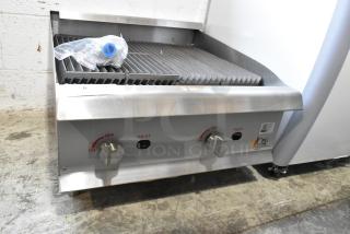 Brand new Cooking Performance Group 351CRCPG24NL stainless steel natural gas charbroiler, 80,000 BTU, includes control knobs.