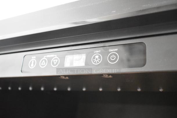 Control panel of AvaValley 342WRC220SZ wine cooler, featuring temperature, light, and power buttons, with digital display.