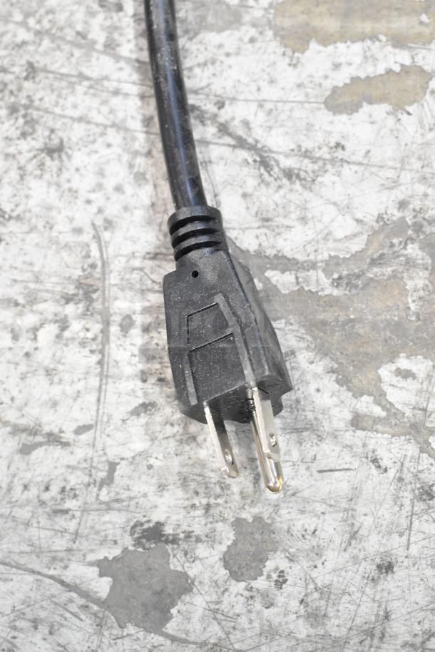 Power plug for a 2025 Carnival King Coldream 4M beverage dispenser, 115 volts, 1 phase, shown on a scratched surface.