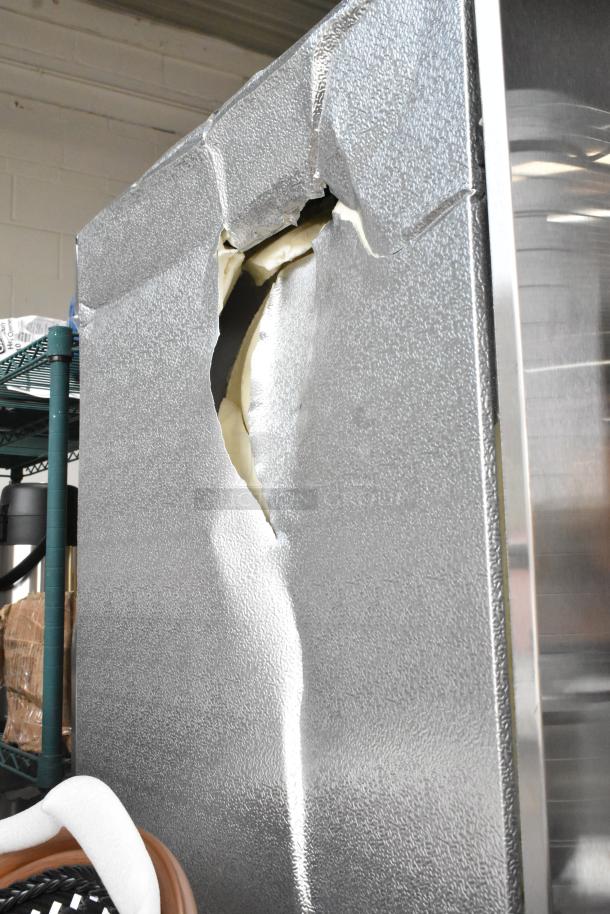 2024 Avantco 829BMR23F stainless steel freezer with visible dent on top. Features poly-coated racks. 115 Volts, 1 Phase.
