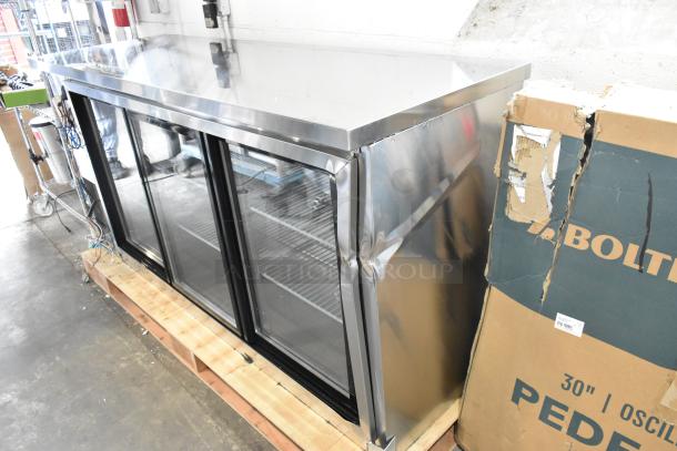 Brand new Avantco 178UBB72SHCS 3-door stainless steel back bar cooler, 115V, with visible dents on side.