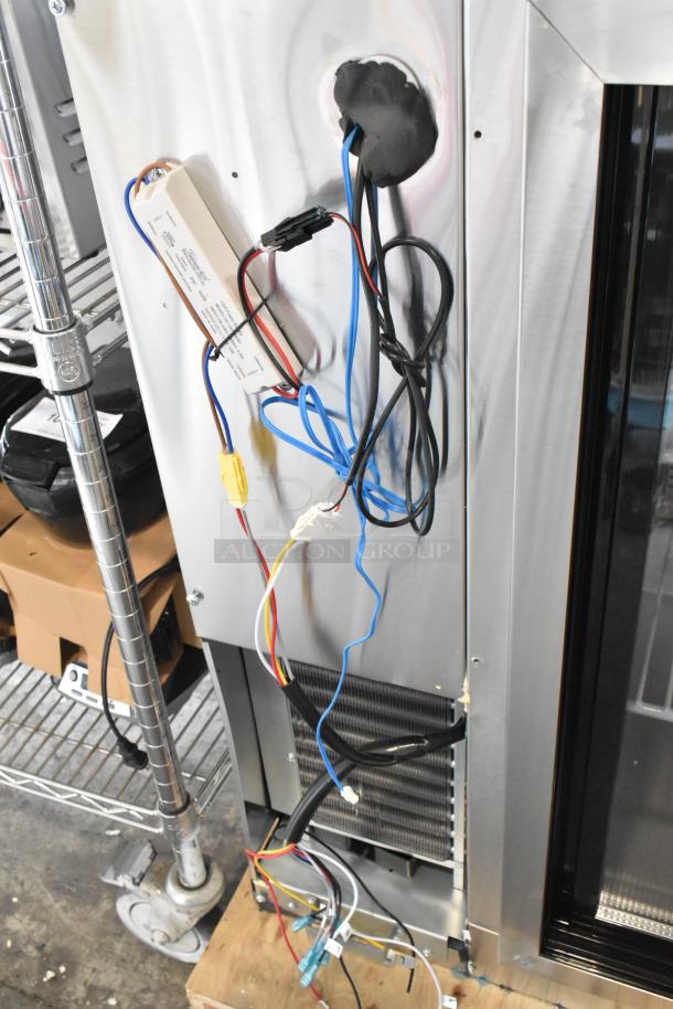 Stainless steel Avantco 178UBB72SHCS back bar cooler with visible wiring. Scratch and dent condition. 115V, 1 phase.