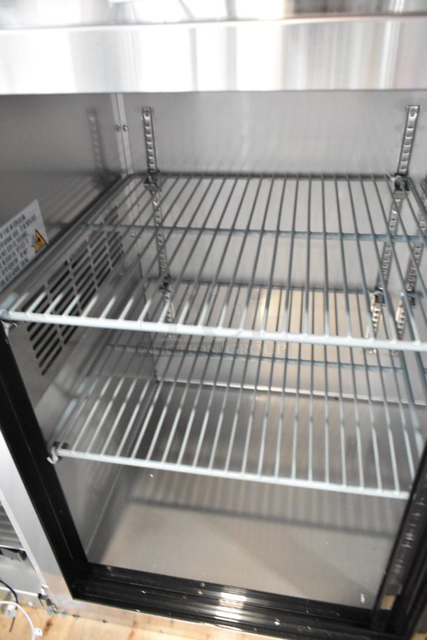Brand new Avantco 178UBB72SHCS stainless steel back bar cooler merchandiser; three doors, shelves visible.
