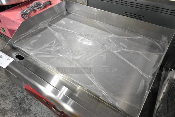 Brand new Avantco 177EG24N stainless steel electric countertop griddle, 208-240V, with protective covering, scratch and dent.