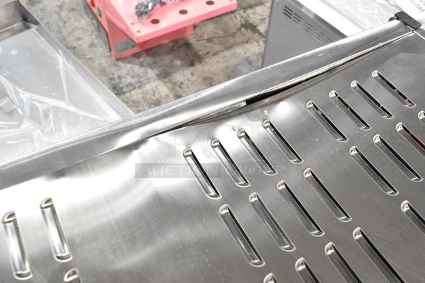 Brand new ServIt 423PDW18D1 stainless steel pizza warmer with 4-shelf rotating rack. Note visible broken glass.