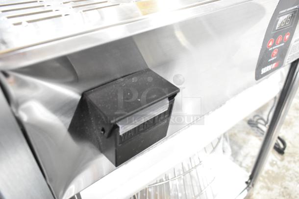 ServIt 423PDW18D1 stainless steel pizza warmer with digital controls, shown with minor dent and visible shelf inside.
