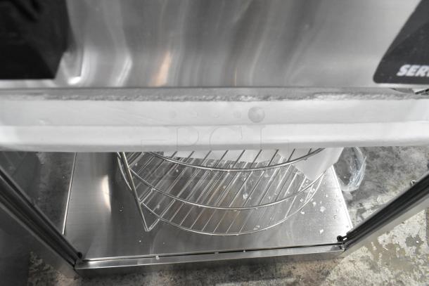ServIt 423PDW18D1 stainless steel pizza warmer, 18", 4-shelf rotating rack, visible broken glass, 120V, 1 phase.