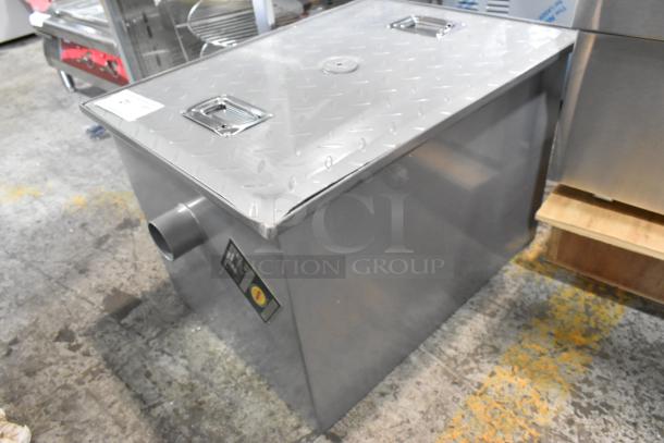 BRAND NEW Regency 600GT15 30 lb. grease trap, 15 GPM, 2" non-threaded connections. Features minor scratches, dented edge.