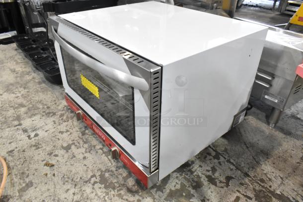 Brand new Avantco 177CO16 stainless steel countertop convection oven, half size, 1.5 cu. ft., 120V, with visible dent.