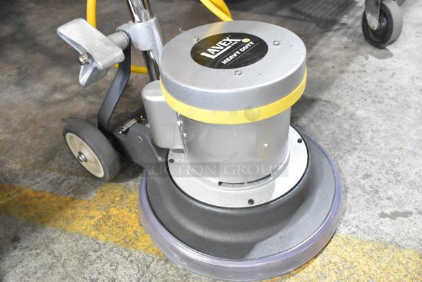Brand new Lavex DP-1334 heavy duty floor cleaning machine; 120 volts, 1 phase; slight scratch and dent; heavy-duty label visible.