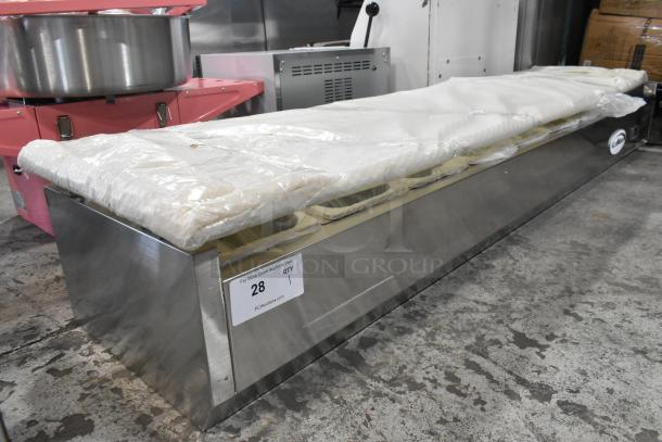 Brand new KoolMore SCDC-8P-SG stainless steel 71" eight pan refrigerated prep station. Visible auction tag, slight scratches.