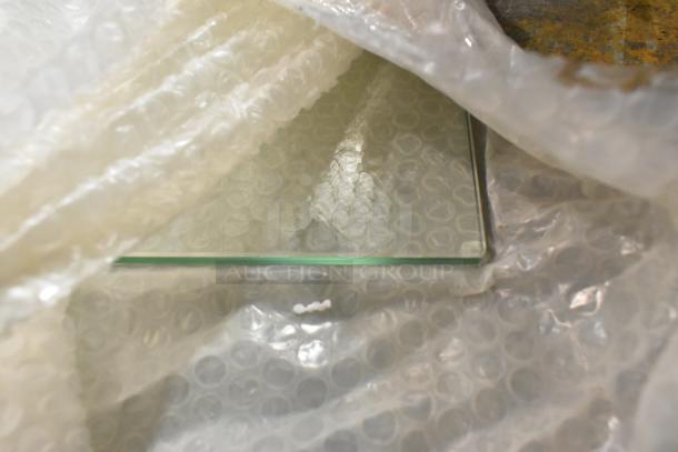 Brand new KoolMore SCDC-8P-SG condiment prep station in original packaging with protective bubble wrap partially removed.