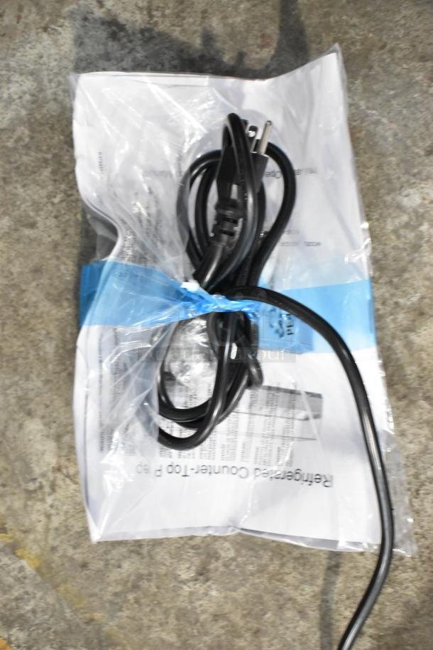 Packaging for a KoolMore SCDC-8P-SG prep station, showing power cord and documents; new condition.