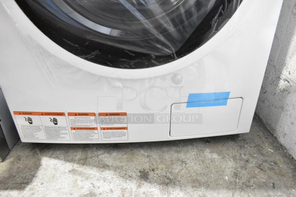 BRAND NEW 2024 KoolMore FLC-3CWH 2.7 cu. ft. washer-dryer combo, 120V, scratch and dent, warning labels visible.