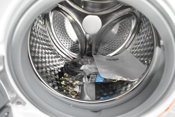 2024 KoolMore FLC-3CWH washer-dryer drum interior, new condition, with installation parts and tags visible.