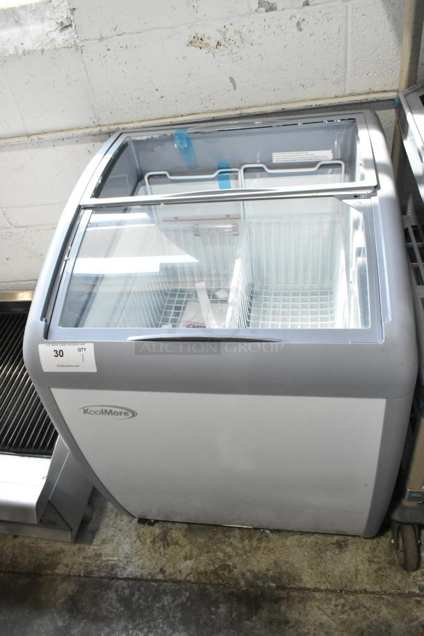 Brand new KoolMore MCF-6C ice cream freezer on casters. Features broken glass sliding door. 26 in, 115V, 1 Phase.